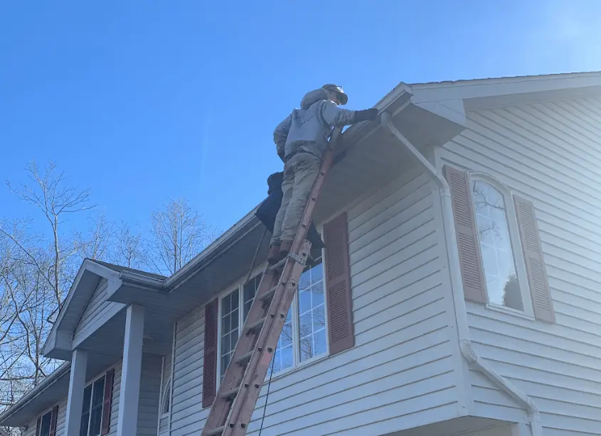 Gutter cleaning and maintenance being performed by Brecksville Power Washing in Brecksville